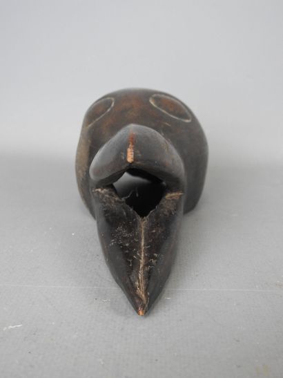 DAN, IVORY COAST. Diminutive mask with bird's...