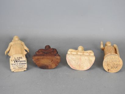 Four wooden STATUETTES representing deities...