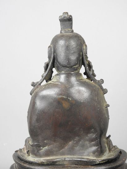 BOUDDHA as a tailor, patinated bronze. Early...
