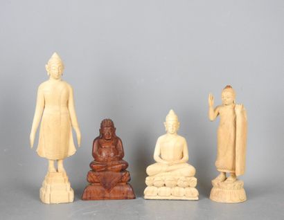 Four wooden STATUETTES representing deities...