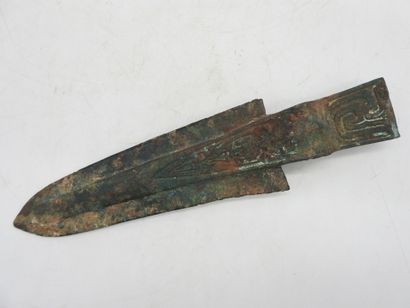 Halberd with socket decorated in relief....