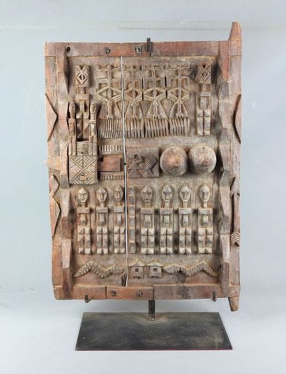 Carved wood panel with figures. On base....