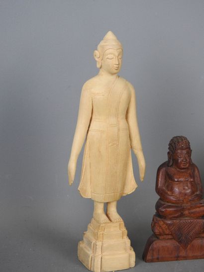 Four wooden STATUETTES representing deities...
