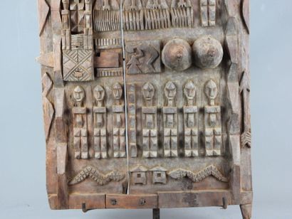Carved wood panel with figures. On base....