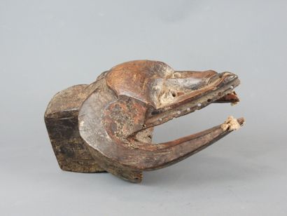 Dance mask with triangular face framed by...