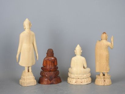 Four wooden STATUETTES representing deities...
