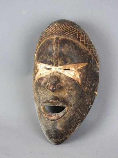 Dance mask marked with a white band across...
