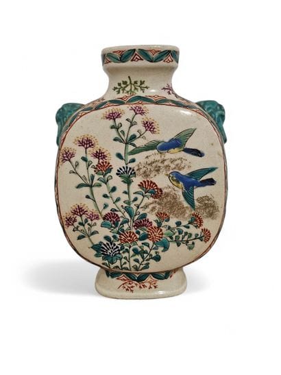 A polychrome porcelain gourd vase decorated...