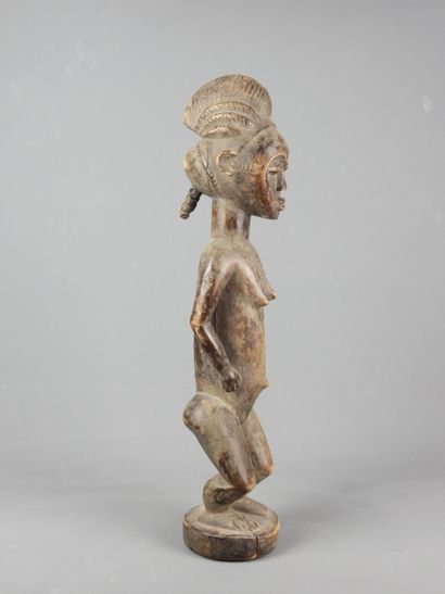 BAOULE, Côte d'Ivoire.

Statue en bois représentant...
