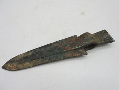 Halberd with socket decorated in relief....