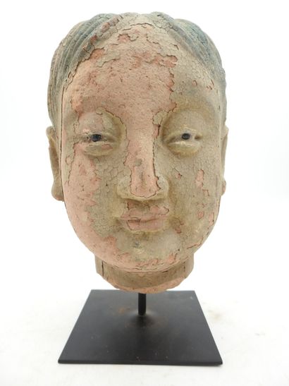 China. Earthenware man's head on a wooden...