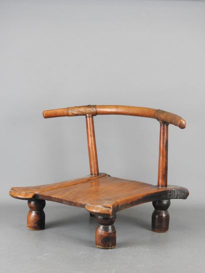 DAN, Ivory Coast. Wooden chair with brown...