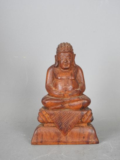Four wooden STATUETTES representing deities...