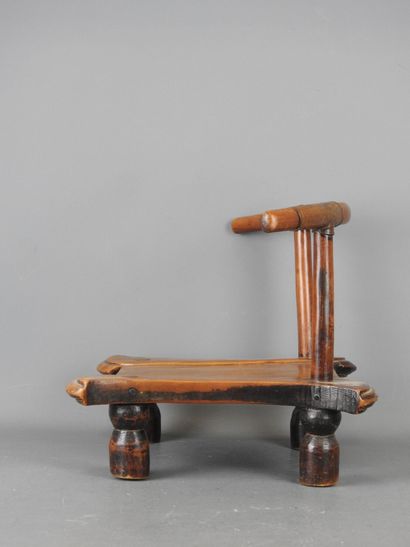 DAN, Ivory Coast. Wooden chair with brown...