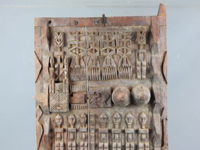 Carved wood panel with figures. On base....