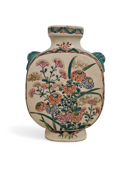 A polychrome porcelain gourd vase decorated...