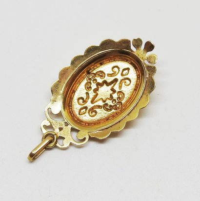 18K gold pendant set with a ruby
H. 4 cm
Total...