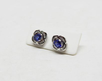 Pair of 18K gold stud earrings set with 2...