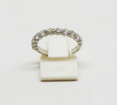 Half wedding band in platinum set with brilliant-cut...