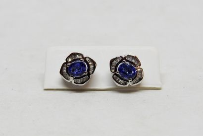 Pair of 18K gold stud earrings set with 2...