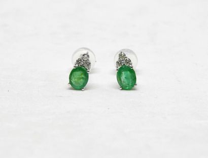 Pair of platinum ear studs set with 2 oval-cut...