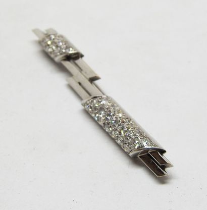 Line brooch in 18 K gold with two pavé-cut...