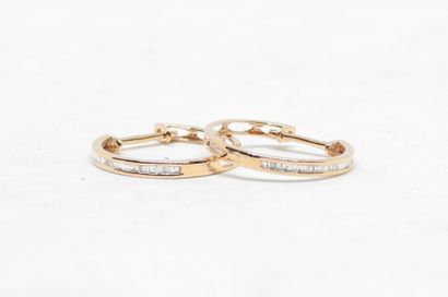 Pair of 18K gold hoop earrings set with 0.15...