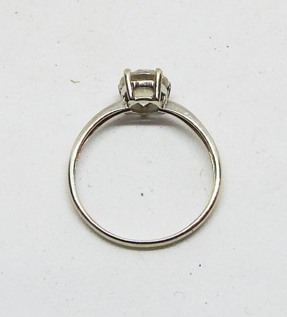 Ring set in 18K gold with a central white...