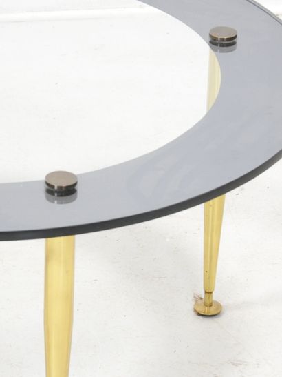 LOW TABLE with circular glass top resting...