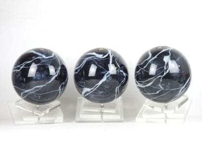 Three resin Balls on Plexiglas base. H. 29...