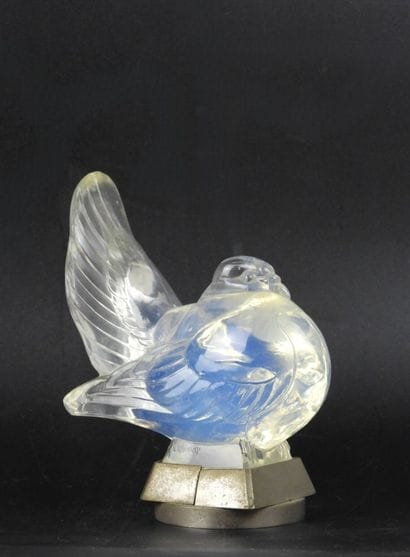 SABINO: Opalescent glass bird forming an...