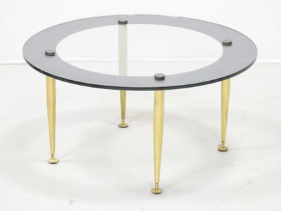LOW TABLE with circular glass top resting...