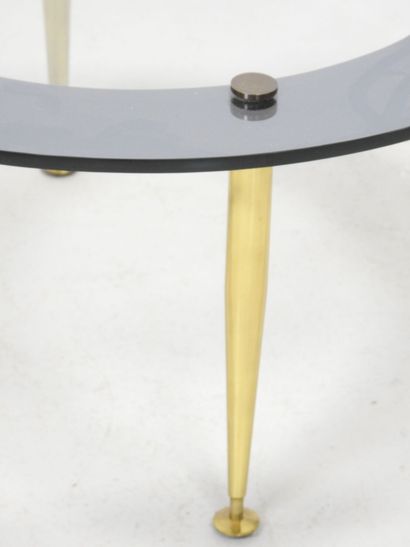 LOW TABLE with circular glass top resting...