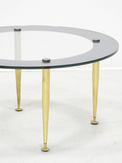 LOW TABLE with circular glass top resting...
