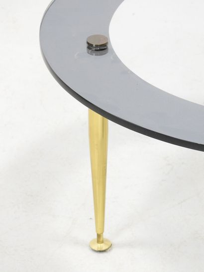 LOW TABLE with circular glass top resting...