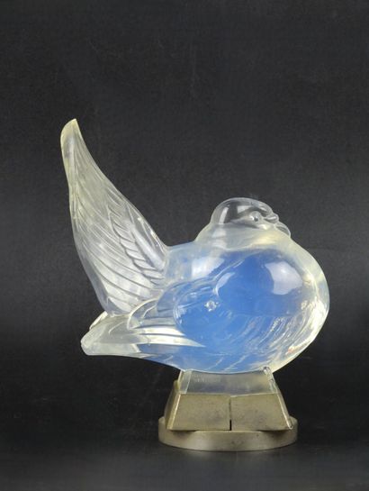 SABINO: Opalescent glass bird forming an...