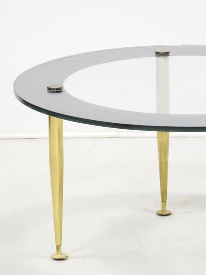 LOW TABLE with circular glass top resting...