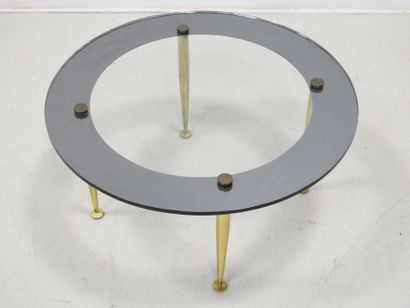 LOW TABLE with circular glass top resting...