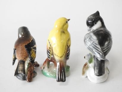 Lot of three polychrome porcelain birds including:...