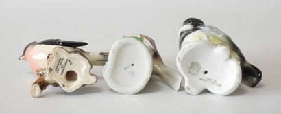 Lot of three polychrome porcelain birds including:...