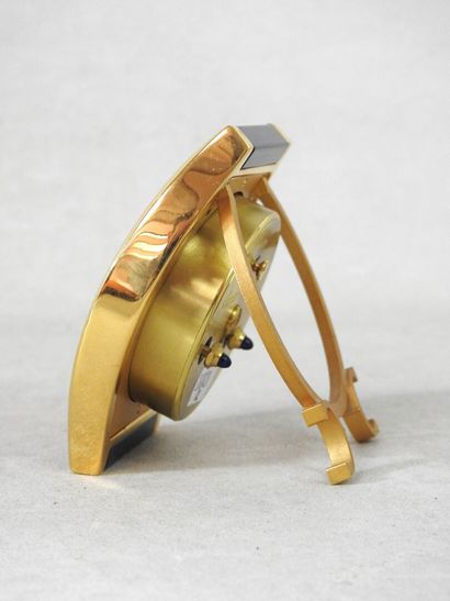 CARTIER
Gilt metal travel clock, blue Tortue...