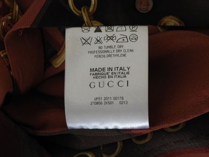 GUCCI
Chemisier en soie à décor de lanières...