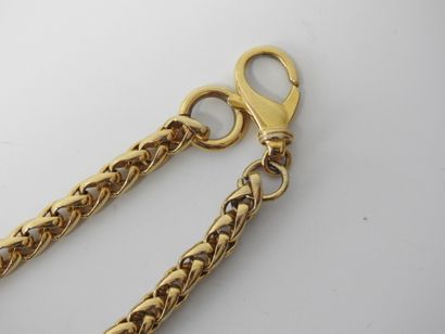 A large piece of costume jewelry, with gilded...
