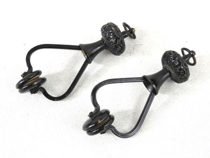 Pair of black lacquered metal jumpers.
Late...