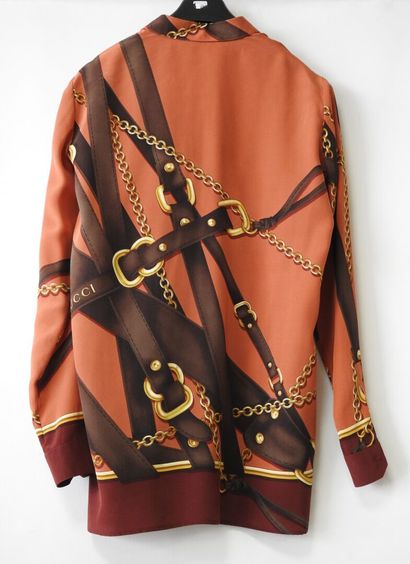 GUCCI
Chemisier en soie à décor de lanières...