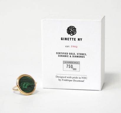 GINETTE NY. 
Disc ring set with a malachite...
