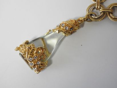 A large piece of costume jewelry, with gilded...