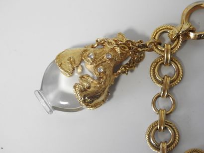A large piece of costume jewelry, with gilded...
