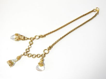A large piece of costume jewelry, with gilded...