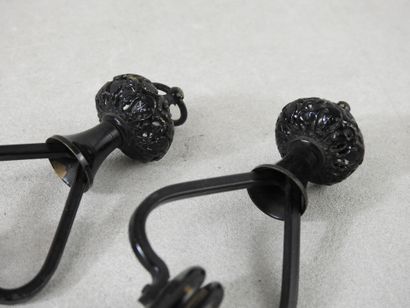 Pair of black lacquered metal jumpers.
Late...
